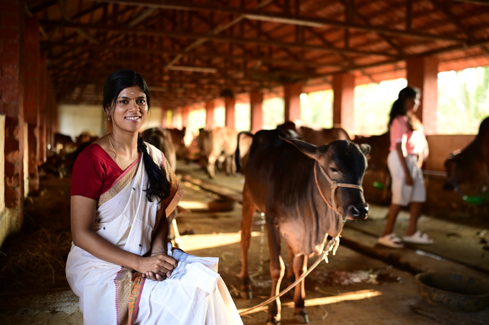 Sharmila Selvakumar at a VilFresh partner dairy farm — the heart of VilFresh
